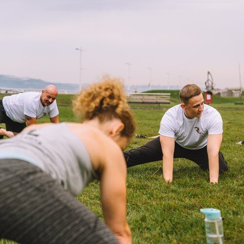 Experienced personal trainer in Neath guiding client technique